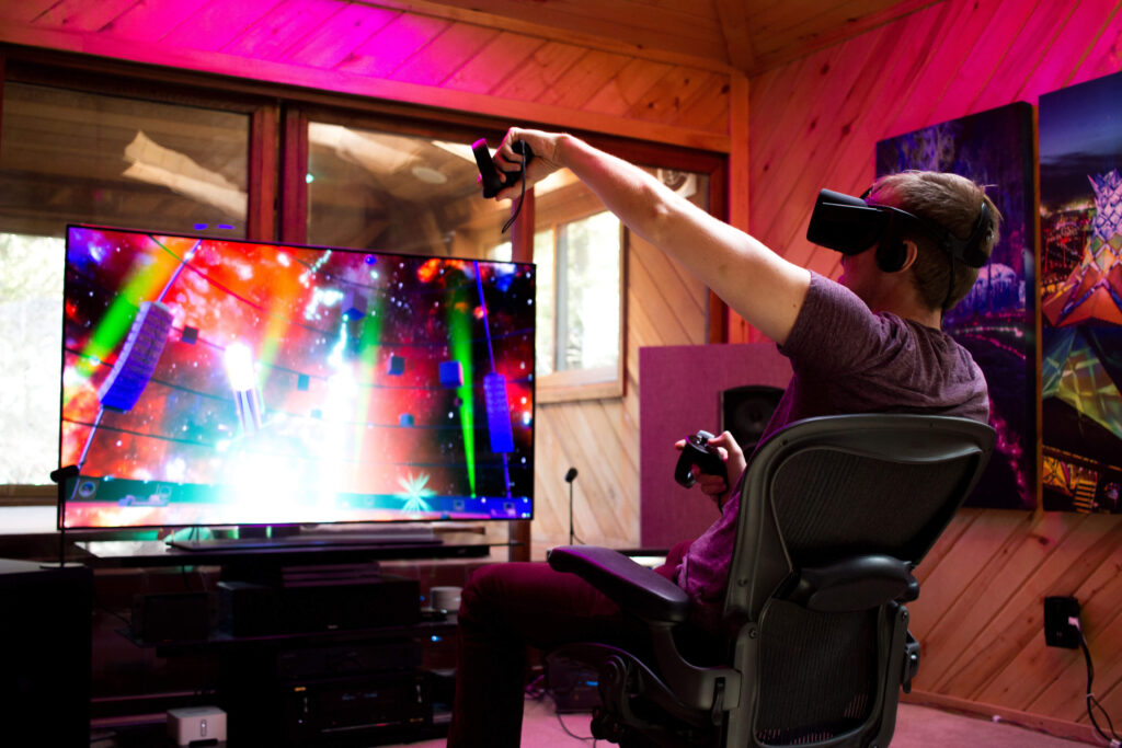 Man using Oculus Quest to play music on screen