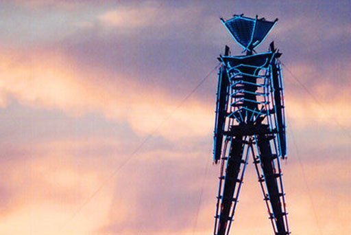 wood and neon statue of Burning Man festival